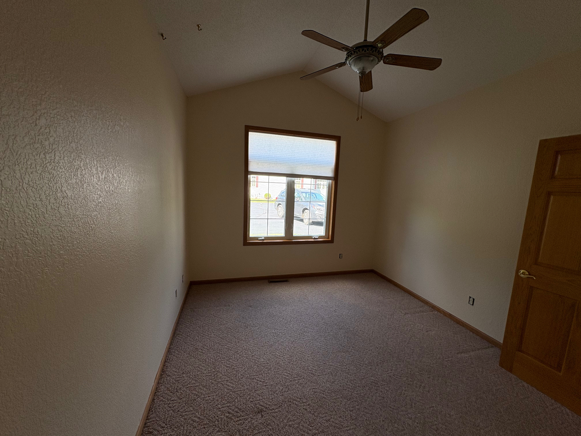 Bedroom Interior Paint — Soft, uniform walls and crisp ceiling lines in a vaulted bedroom.