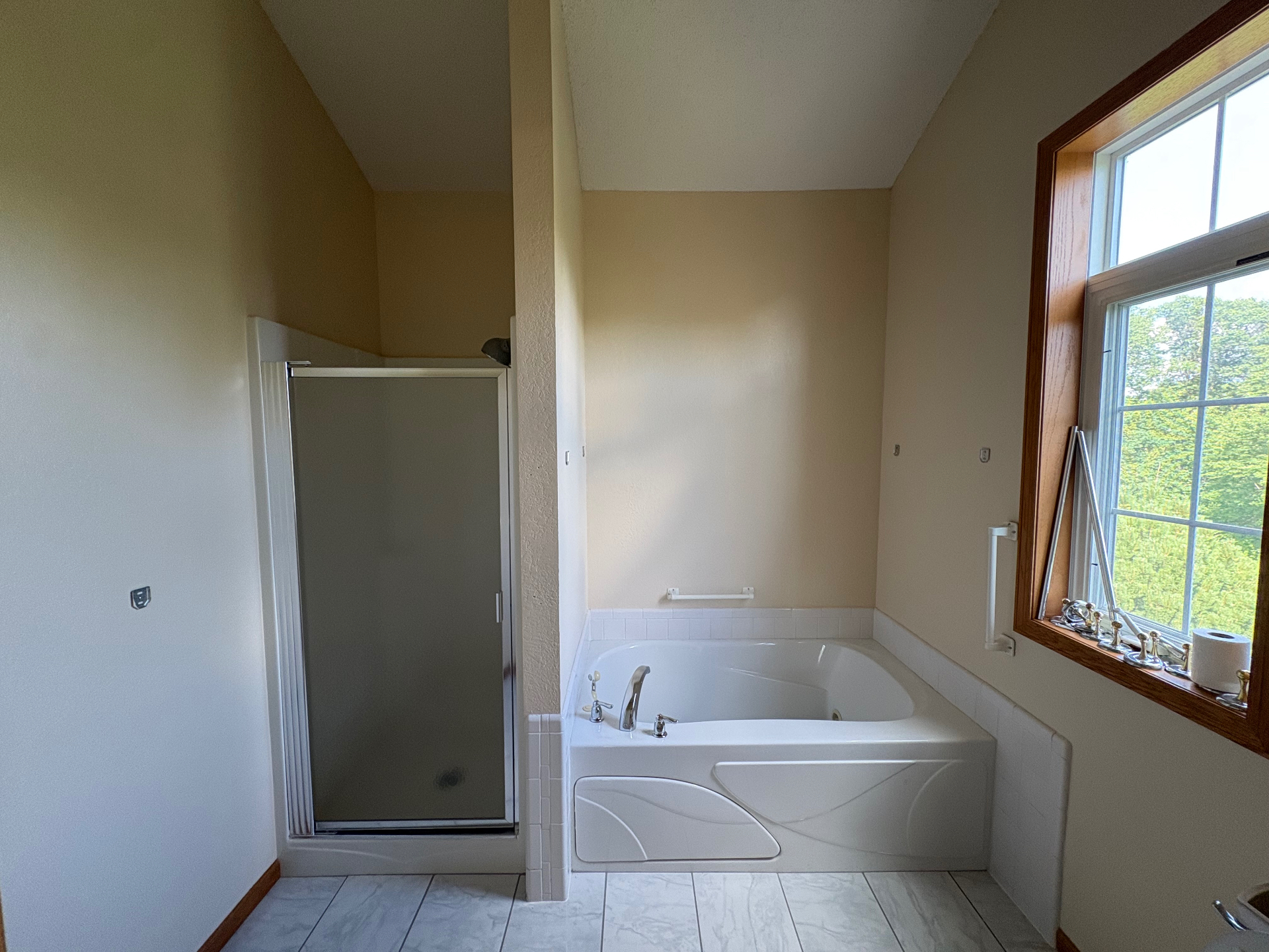 Master Bath Refresh — Clean, updated wall color brightening this vaulted master bath.