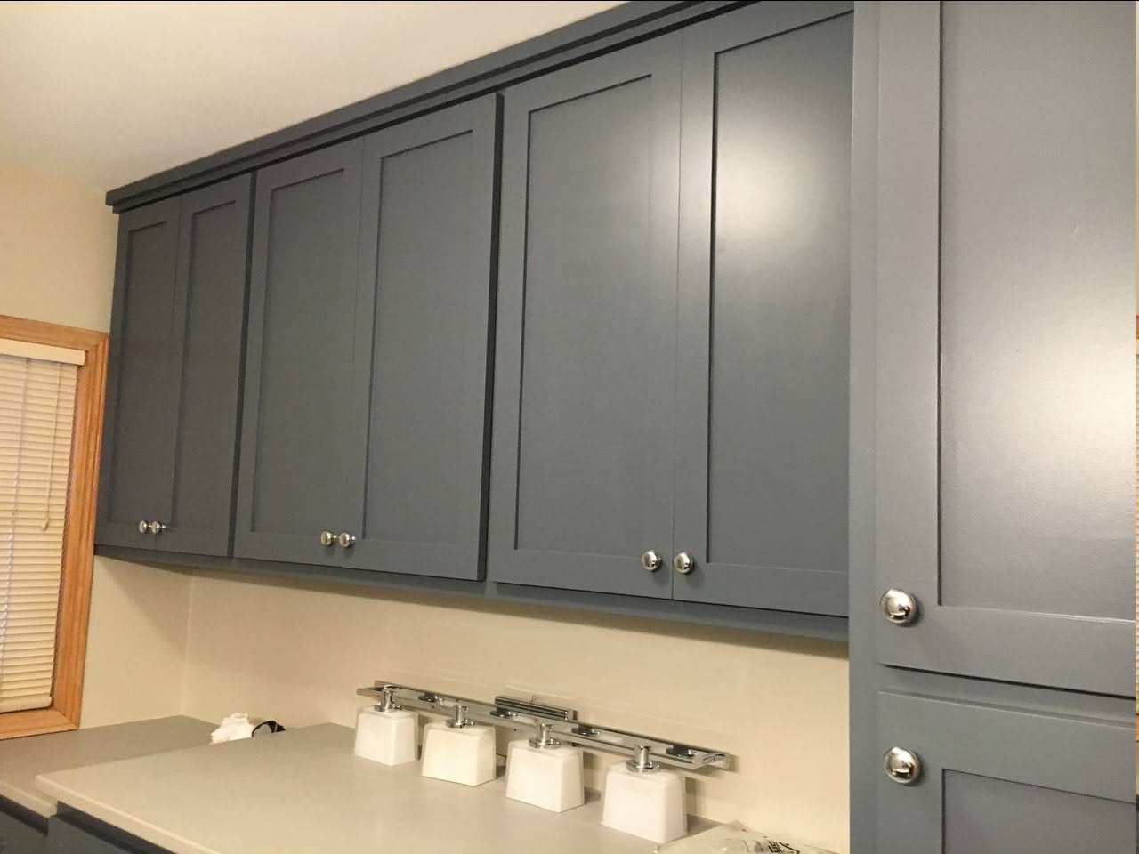 Cabinet Refinishing — Smooth, modern gray cabinet painting with a factory finish.